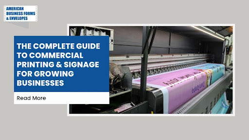 Large-format commercial printer producing colorful signage banners for business marketing and branding